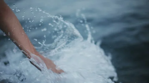 Hand glides over waves Stock Footage 66235812