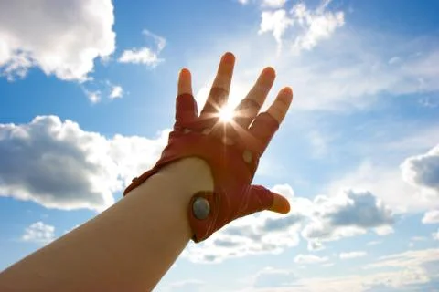 Hand in a glove Stock Photos