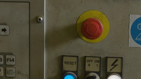 Hand in glove presses red button on industrial machine control board Vídeos de archivo 123917185