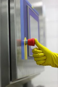 Hand in glove pressing important technology button Stock Photos