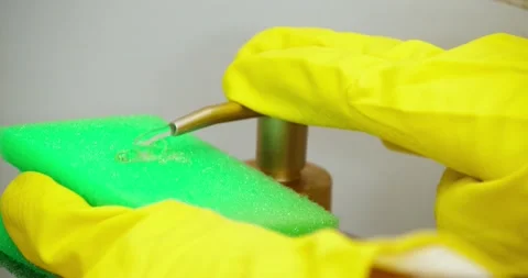 Hand in glove with sponge Video stock 235512392