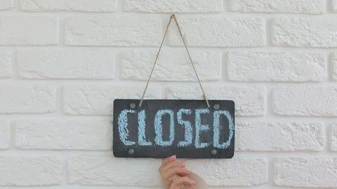 Hand in gloves flips a sign saying open Stock Footage 128663952
