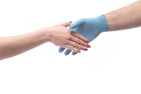 Hand in gloves shaking hand without gloves close up Stock Photos