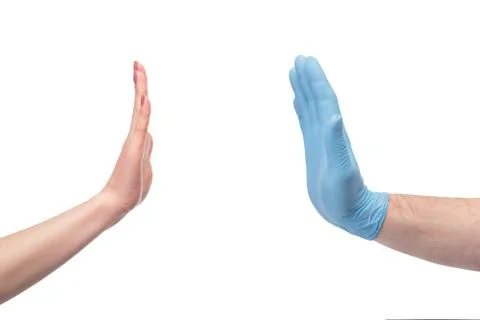 Hand in gloves stoping hand without gloves Stock Photos