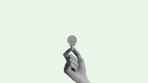 Hand with glowing lightbulb and multicolored arrows pointing in multiple Stock Footage 304052760