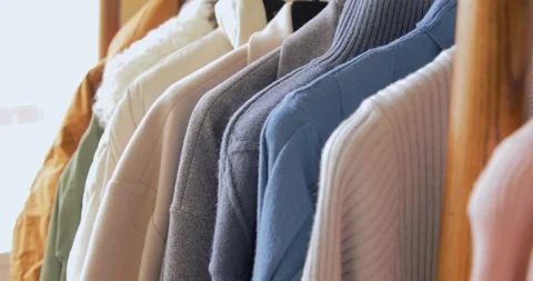 Hand Goes Through Clothes Rack Stock Footage 126032208