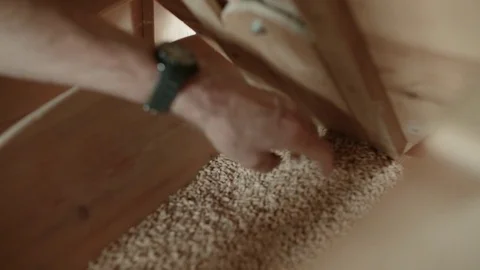 A hand goes through a trough filled with grain and picks it up to inspect it Stock Footage 85214014