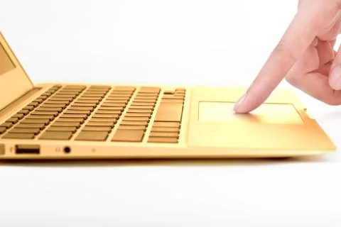 Hand in the golden notebook computer Stock Photos