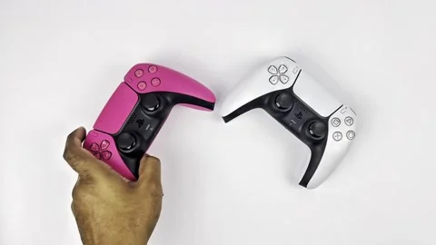A hand grab a controller (DS5 PS5) Stock Footage 321002687