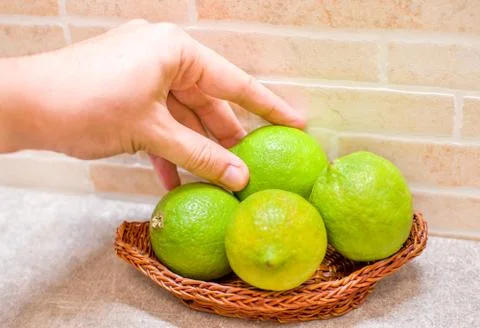 Hand grab lemon Stock Photos