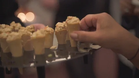 Hand Grabbing a Appetizer Stock Footage 119039266