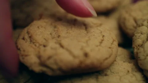 Hand Grabbing Brown Sugar Bourbon Cookie Stock Footage 47649147
