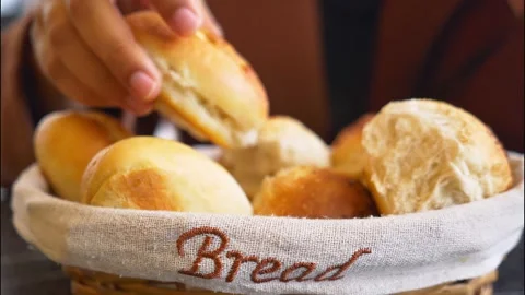 Hand Grabbing Crusty Bread Rolls from Wicker Basket in Slow Motion 4k 動画素材 307599903