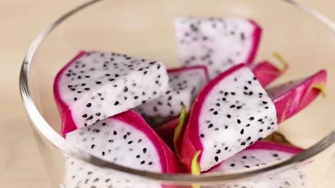 Hand Grabbing Dragon Fruit Slices Stock Footage 310297841