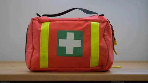 Hand is grabbing first aid kit Stock Footage 125452317