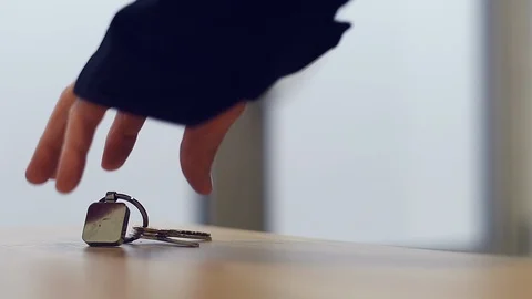 Hand grabbing house keys and leaving home Stock Footage