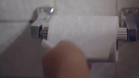 Hand Grabbing Toilet Paper Stock Footage