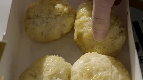 Hand grabs biscuit from box Stock Footage 294441438