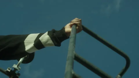 A hand grabs a railing Stock Footage 230910576