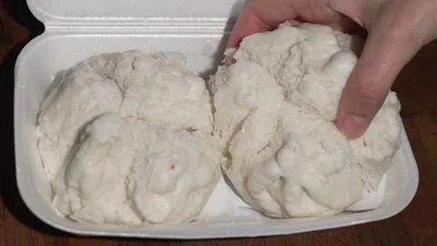 Hand grabs steamed dim sum bun Stock Footage 251830062