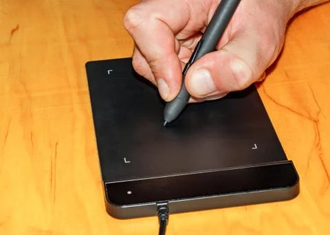 Hand on graphic tablet Stock Photos