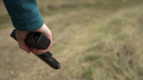 Hand Grasping Pistol Stock Footage 128069482