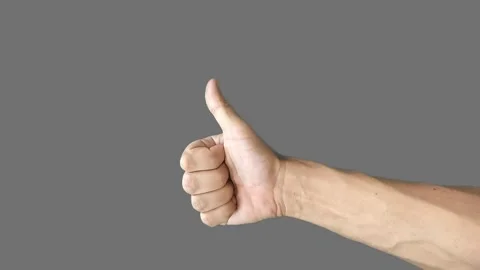 A hand on a gray background shows that everything is fine and good Stock Footage 280436880