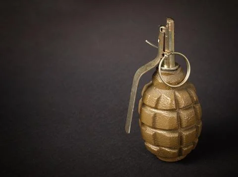 Hand grenade on a dark background Stock Photos