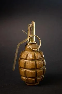 Hand grenade on a dark background Stock Photos