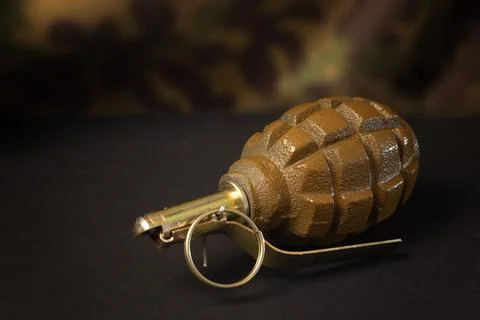 Hand grenade on a dark background Stock Photos