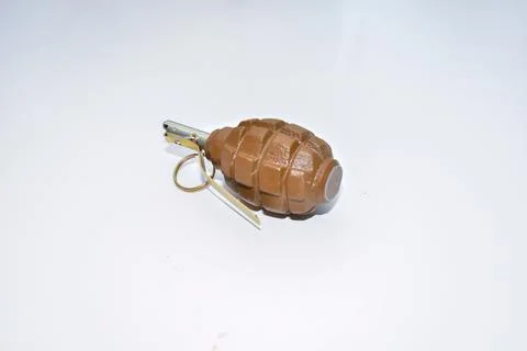 The hand grenade on a white background close-up Фото
