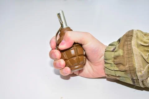 The hand grenade on a white background close-up Fotos de archivo