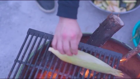 Hand grilling corn and pumpkin slice on barbecue grill Stock Footage 76101785