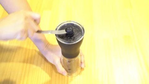 Hand grinder machine with coffee beans Stock Footage 108984312