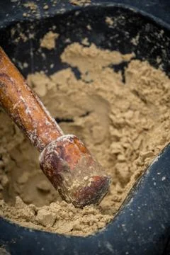 Hand grinding peanuts into paste 스톡 사진