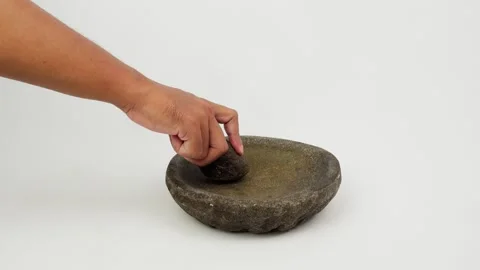 Hand Grinding Spices Using Traditional Mortar and Pestle Video stock 327850727