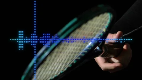 Hand gripping racket starting motion as waveform pulsating syncing highlighting Stock Footage 317123750