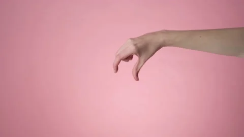 Hand gripping a something small Stock Footage 171910403