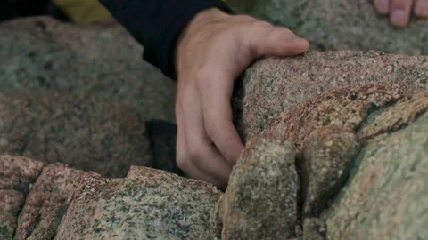 Hand grips boulders while climbing in slow motion Stock Footage 90818329