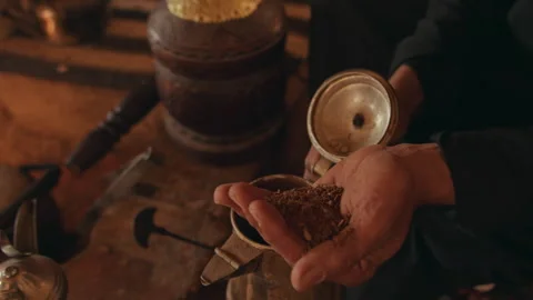 Hand Grounded Coffee put in a Finjan Video stock 270344037