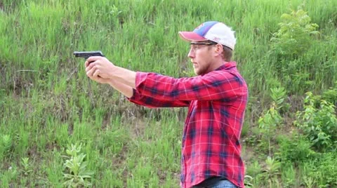 Hand gun being fired off Stock Footage 20557111