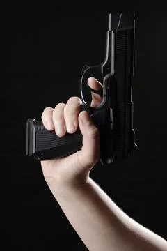 Hand with gun Stockfoto's