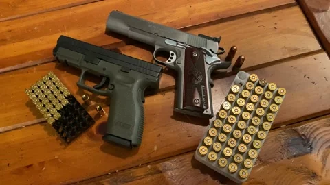 Hand Guns and Ammunition on Table Stock Footage 152248544