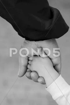 Hand in hand Stock Photos