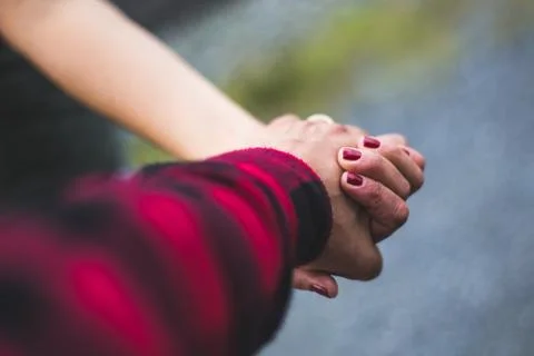 Hand by hand Stock Photos