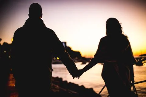 Hand by hand Stock Photos