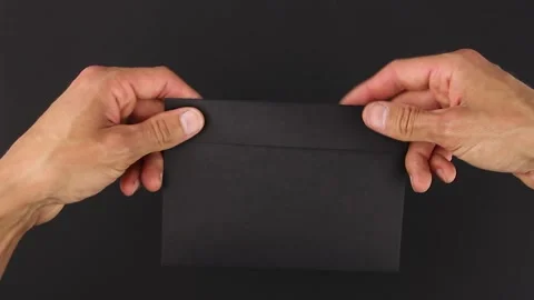 Hand to hand transfer black envelope, evidence package detective investigation Видео 138890833