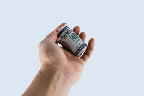 Hand handing over dollars Stock Photos