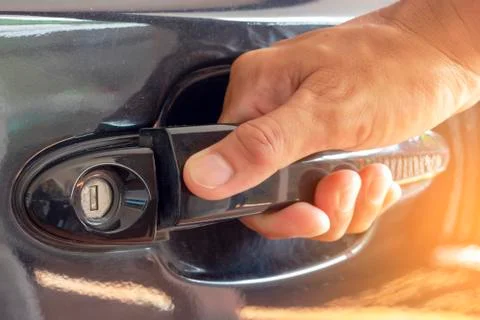 Hand on handle Close up of man hand opening car door Stock Photos