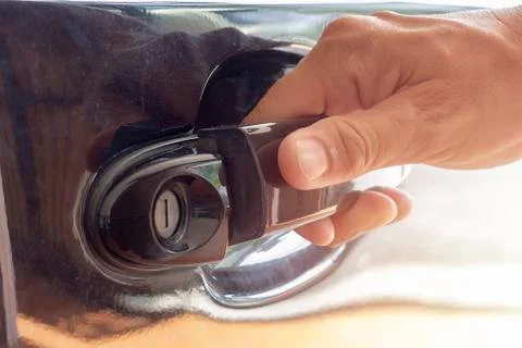 Hand on handle Close up of man hand opening car door Stock Photos